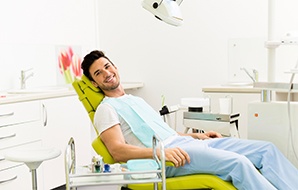 Happy man in the dental chair.