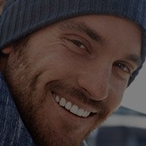 Smiling bearded man wearing blue beanie