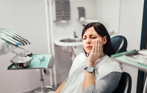 Woman visiting dentist for dental emergency in Canonsburg, PA