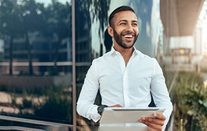 Young male professional smiling at work
