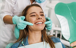 Woman smiling in the dental chair