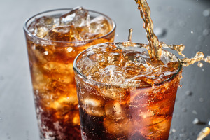 Pouring soda into a glass